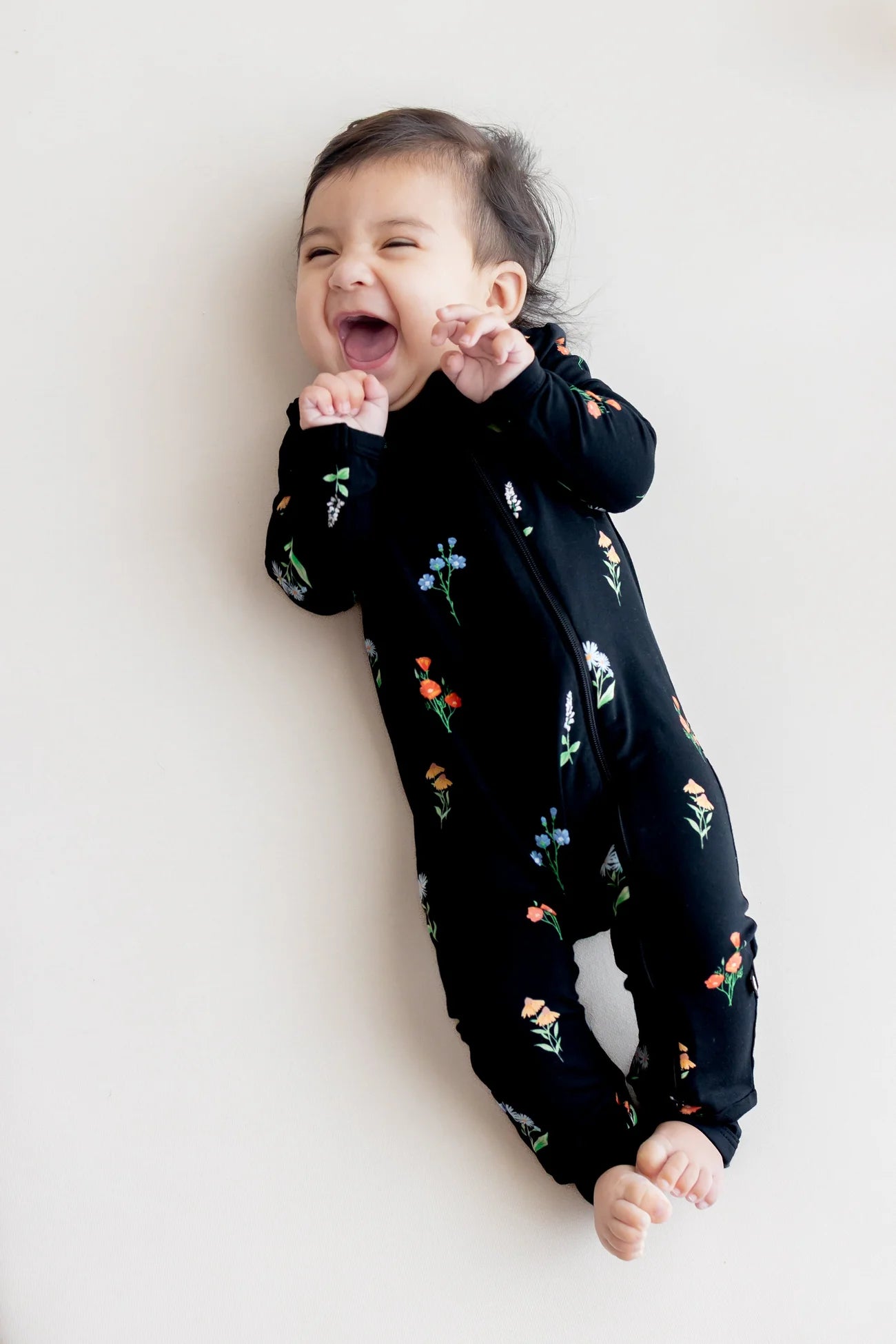 Kyte Baby Zippered Romper in Midnight Wildflower