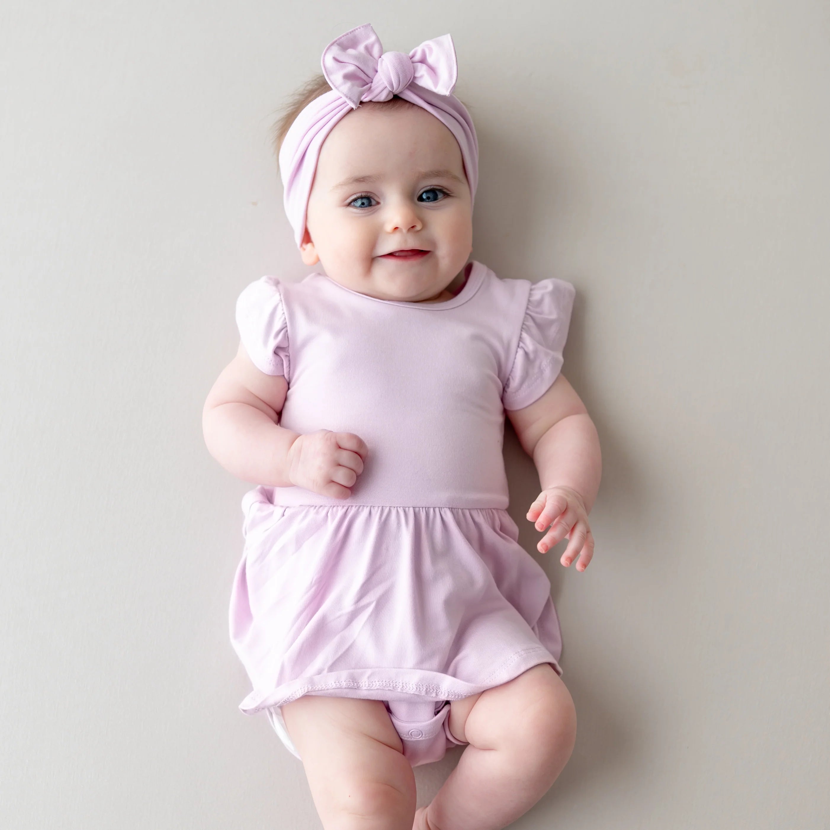 Kyte Baby Twirl Bodysuit Dress in Thistle